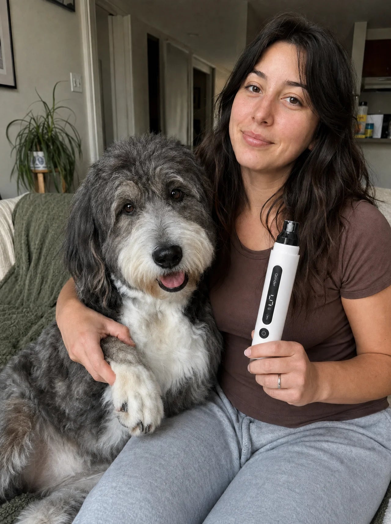 A calm dog resting with its owner holding DozyPup