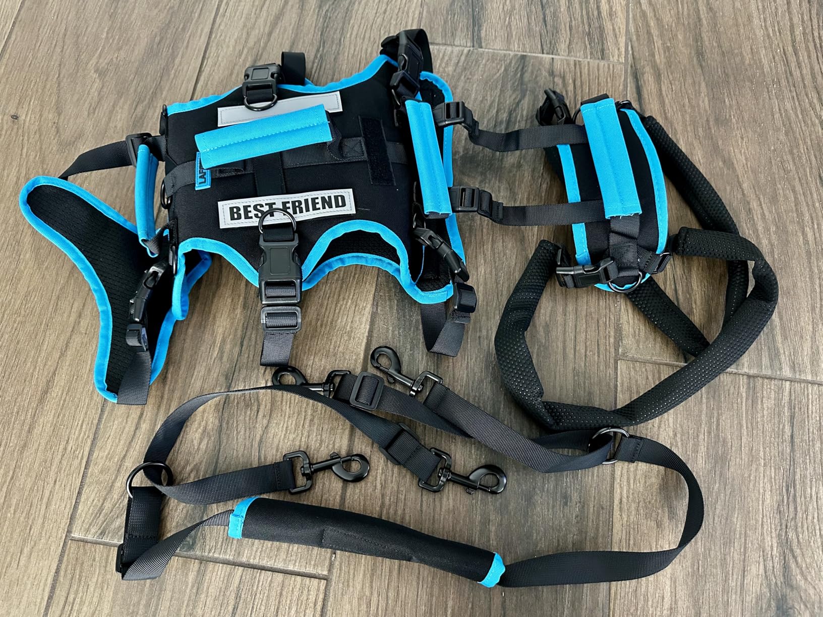 Kat M.’s photo of the harness sections and lift straps on a wooden floor